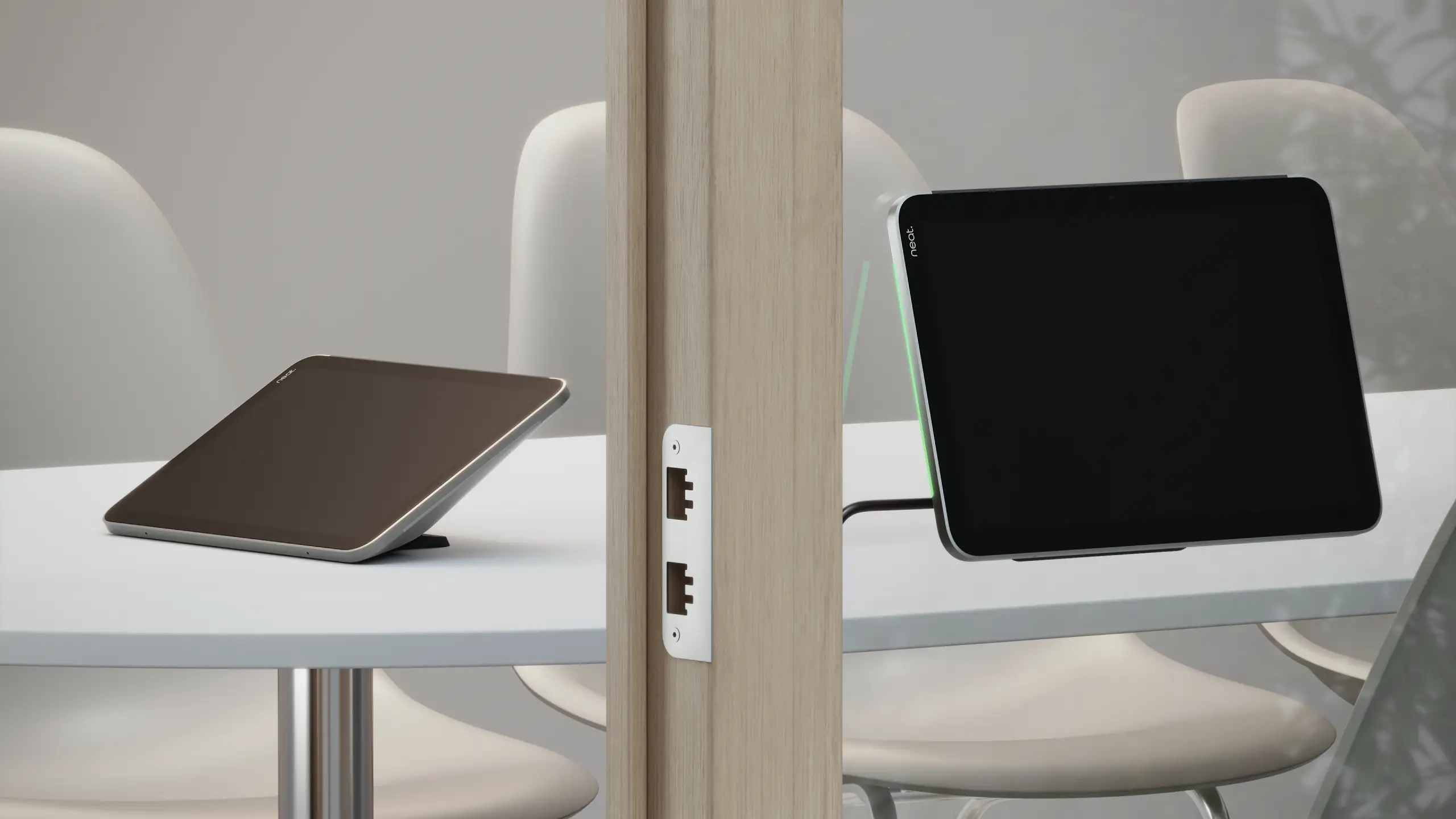 Two Neat Pad Pros. One acts as a meeting controller, the other as a scheduling display.